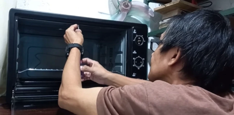 Home 9 Technician servicing a residential oven in Abilene, TX